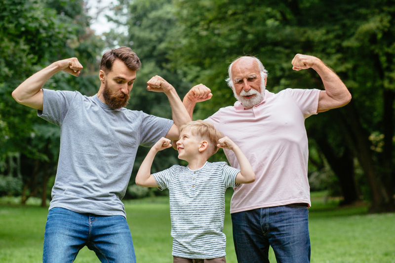 Three generations flexing in the park